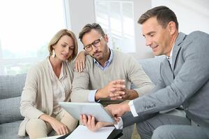 insights.wjohnsonassociates.comhs-fshubfsStock imagesFinancial adviser showing terms of contract on tablet